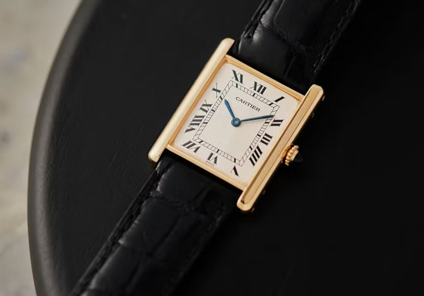 The “Sexy Because I’d Be A Good Wife” Watch: Tank Louis Cartier replica for sale in yellow gold with leather strap